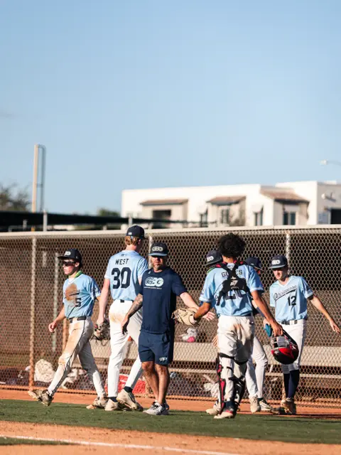 GBG Colorado 2029 coach walking off the field with players
