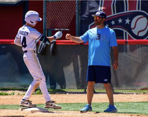 GBG Colorado coach talking with a player near the dugout