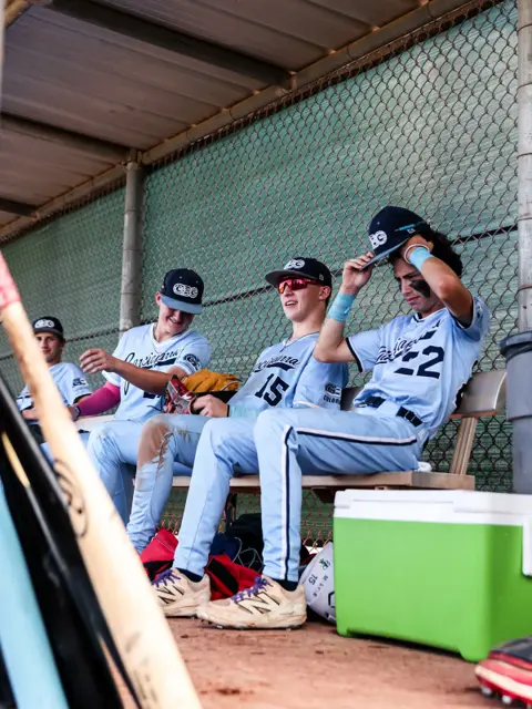 GBG Colorado players sitting together in the dugout
