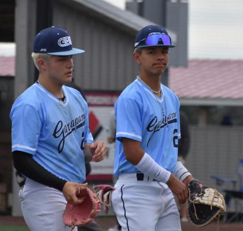 Two GBG Colorado infielders walking in from the field